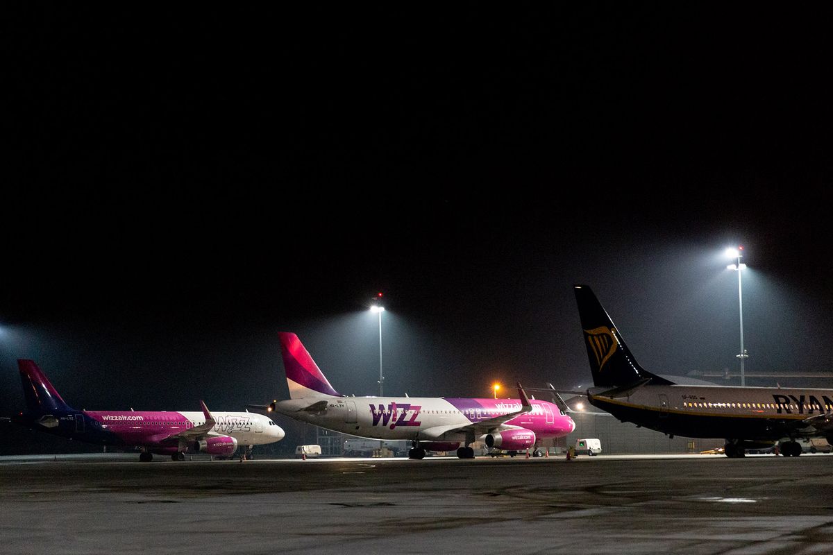 Airplanes of Wizzair seen arriving at Krakow Balice Airport as many International flights are canceled due to increased number of Covid-19 cases in Europe Krakow, Poland on January 8, 2021. The airline industry have been badly hit  after global Coronavirus lockdown cut most of international passenger flights. (Photo by Dominika Zarzycka/NurPhoto) (Photo by Dominika Zarzycka / NurPhoto / NurPhoto via AFP)