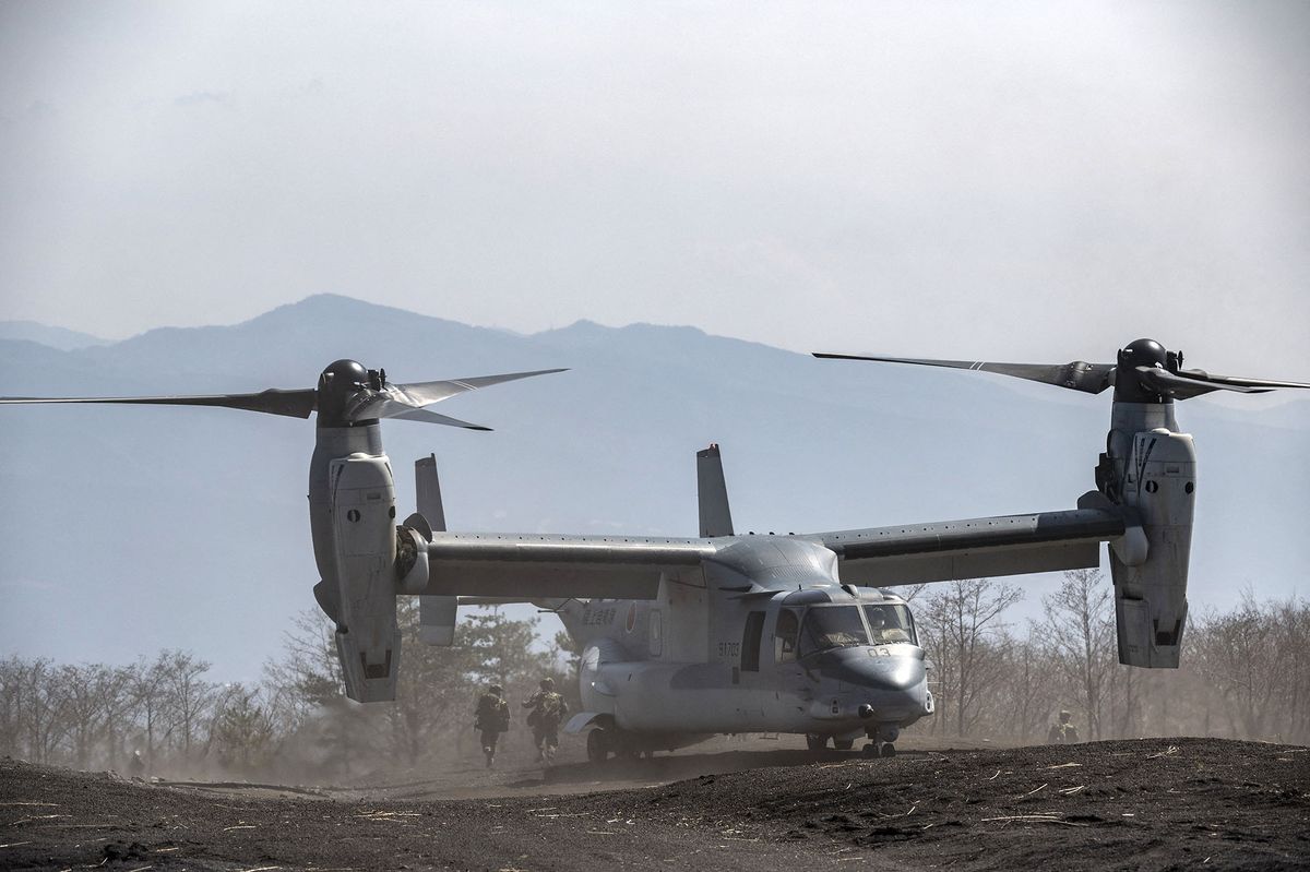 Soldiers exit a Japanese Self-Defense Force MV-22 Osprey tilt-rotor aircraft during a joint exercise with US Marine Corps personnel at the Higashifuji training area in Gotemba, Shizuoka Prefecture on March 15, 2022. (Photo by Charly TRIBALLEAU / AFP)