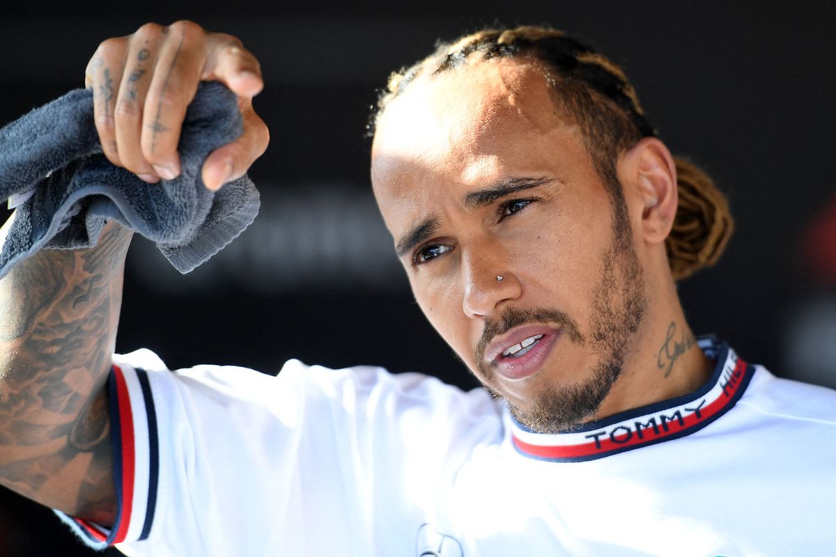 Mercedes' British driver Lewis Hamilton talks to the media after the Formula One Azerbaijan Grand Prix at the Baku City Circuit in Baku on June 12, 2022. (Photo by NATALIA KOLESNIKOVA / AFP)