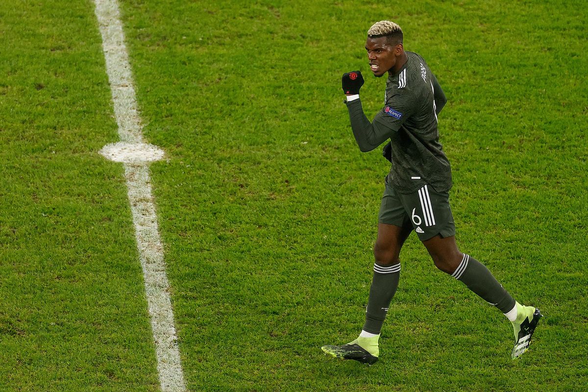 Manchester United's French midfielder Paul Pogba celebrates scoring the 3-2 goal during the UEFA Champions League Group H football match RB Leipzig v Manchester United in Leipzig, eastern Germany, on December 8, 2020. (Photo by Odd ANDERSEN / various sources / AFP)