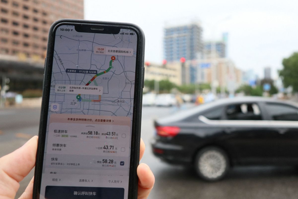 People use Didi, an application of Chinese taxi hire in Beijing on Aug. 28, 2021. Didi Chuxing Technology Co.provides app-based transportaion service and over 550 million, tens of millions of drivers carry the app. ( The Yomiuri Shimbun ) (Photo by Koki Kataoka / Yomiuri / The Yomiuri Shimbun via AFP)