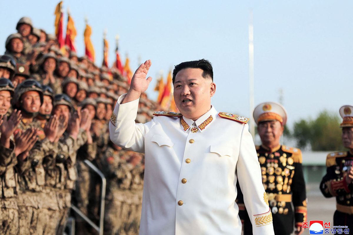 This picture taken on April 27, 2022 and released by North Korea's official Korean Central News Agency (KCNA) via KNS on April 29 shows North Korean leader Kim Jong Un taking part in a parade ceremony to mark the 90th founding anniversary of the Korean People's Revolutionary Army (KPRA), at an undisclosed location in North Korea. (Photo by KCNA VIA KNS / AFP)