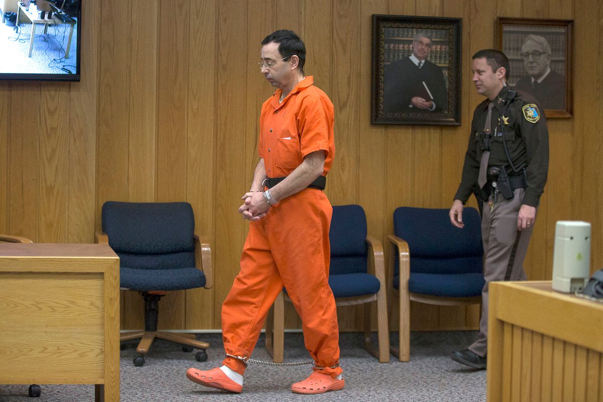 Former Michigan State University and USA Gymnastics doctor Larry Nassar enters the court room for his final sentencing phase in Eaton County Circuit Court on February 5, 2018 in Charlotte, Michigan. (Photo by RENA LAVERTY / AFP)