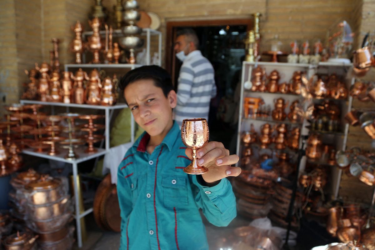 KIRMAN, IRAN - MAY 12: A view from shop selling copper pots and ornaments at a copper bazaar from the Safavid period in Kirman, Iran on May 12, 2022. Fatemeh Bahrami / Anadolu Agency (Photo by Fatemeh Bahrami / ANADOLU AGENCY / Anadolu Agency via AFP)