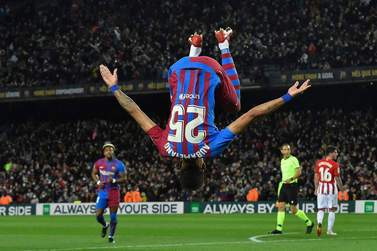 Barcelona's Gabonese midfielder Pierre-Emerick Aubameyang does a somersault celebrates after scoring his team's first goal during the Spanish league football match between FC Barcelona and Athletic Club Bilbao at the Camp Nou stadium in Barcelona on February 27, 2022. (Photo by Pau BARRENA / AFP)