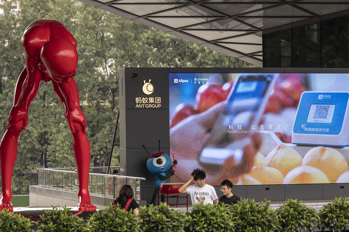 1234395979 A sculpture by artist Chen Wenling, left, and an Ant Group Co. mascot at the company's headquarters in Hangzhou, China, on Monday, Aug. 2, 2021. Alibaba Group Holding Ltd., which holds a 33% stake in Ant, is scheduled to report first-quarter results on Aug. 3. Photographer: Qilai Shen/Bloomberg via Getty Images