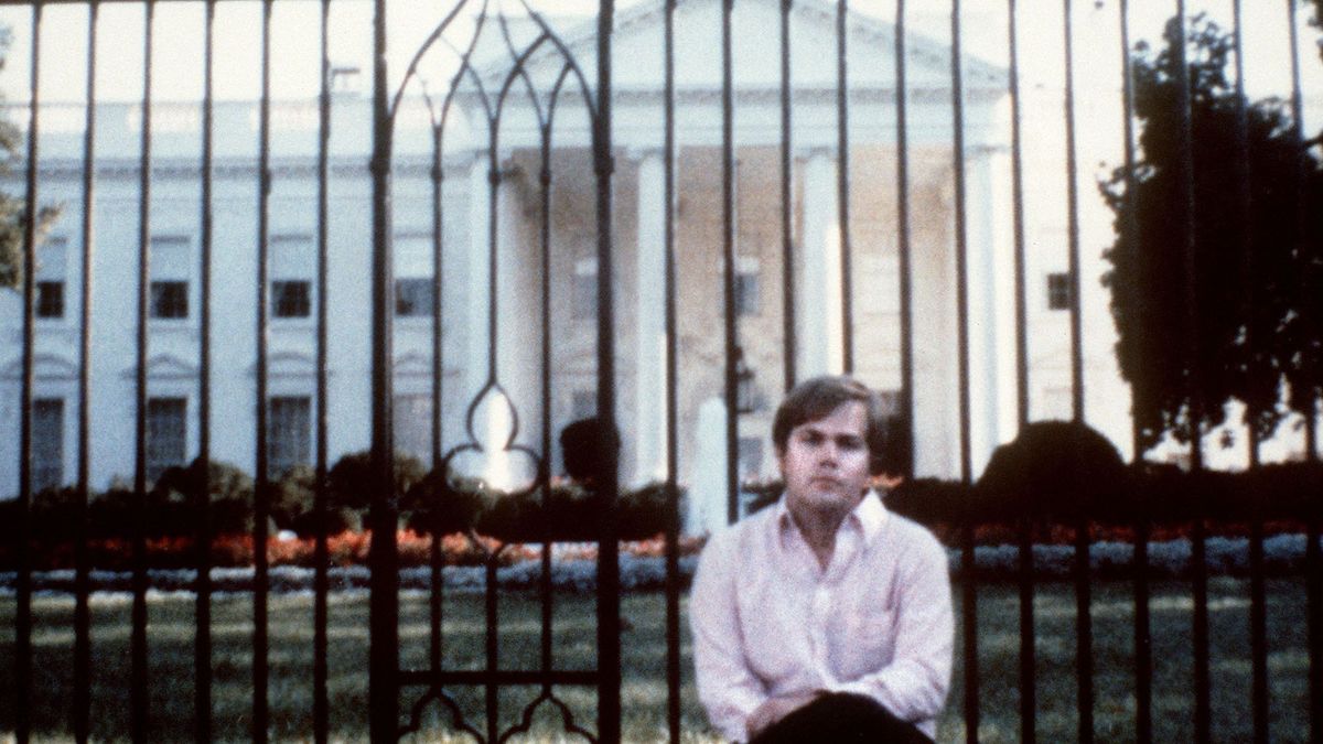 Picture taken in front of the White House of John Hinckley who attempted to assassinate US President Ronald Reagan in Washington, D.C., on March 30, 1981, as the culmination of an effort to impress actress Jodie Foster. He was found not guilty by reason of insanity and has remained under institutional psychiatric care since then. Reagan was hit by one of six shots fired by John Hinckley, who also seriously injured press secretary James Brady. Reagan was hit in the chest and was hospitalized for 12 days. Hinckley was aquitted on June 21, 1982 after a jury found him mentally unstable. (Photo by AFP)