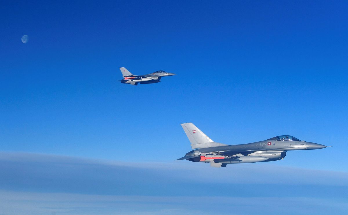 Danish Air Force F-16  are seen during a NATOís Baltic Air Policing drill simulating an interception of a civilian flight near Siauliai airport in Lithuania, on January 14, 2020. (Photo by John THYS / AFP)
