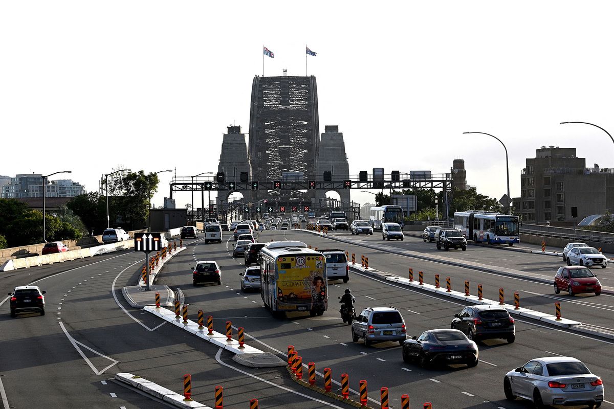 Early morning traffic is seen on the Harbour Bridge in Sydney on May 15, 2020. - The New South Wales state relaxed COVID-19 restrictions around public gathering and businesses from today. (Photo by Saeed KHAN / AFP)
