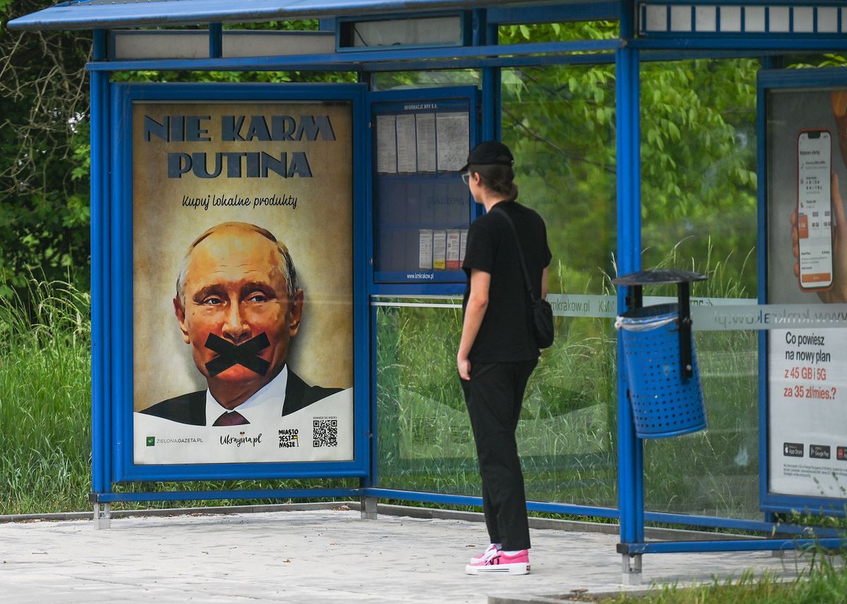 A poster promoting the campaign 'Don't feed Putin, buy local products' seen on a bus stop in Krakow.On Thursday, May 26, 2022, in Krakow, Poland. (Photo by Artur Widak/NurPhoto) (Photo by Artur Widak / NurPhoto / NurPhoto via AFP)