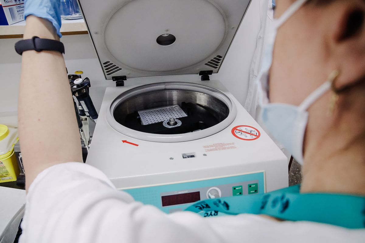 1400054865 MADRID, SPAIN - MAY 30: A nurse centrifuge to prepare the PCR plate for monkeypox testing, at the Ramon y Cajal Hospital, on 30 May, 2022 in Madrid, Spain. The Community of Madrid begins today to carry out PCR and genomic sequencing tests for monkeypox or monkeypox simian smallpox in five public hospitals in the region to determine the positivity of the cases. This decision was taken after the regional government criticized the lack of speed of the Ministry of Health in communicating the results of the analyses carried out by the laboratory of the National Microbiology Center of the Carlos III Health Institute. According to the latest data, there are 75 positive cases of monkeypox in the region, including a single woman who is a secondary contact, and another 46 cases are under study as suspects. (Photo By Carlos Lujan/Europa Press via Getty Images)