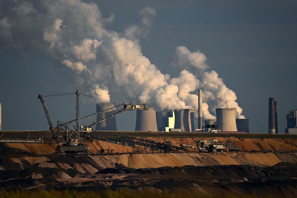 (FILES) In this file photo taken on October 27, 2021 open-cast lignite mining is seen near the coal-fired power station Neurath of German energy giant RWE in Garzweiler, western Germany. - Germany said on June 20, 2022 it still aimed to close its coal power plants by 2030, despite a recent decision to revert to the fuel in the midst of an energy crisis provoked by Russia's invasion of Ukraine. "The 2030 coal exit date is not in doubt at all. It is more important than ever that it is realised in 2030," economy ministry spokesman Stephan Gabriel Haufe said at a regular press conference. (Photo by Ina FASSBENDER / AFP)