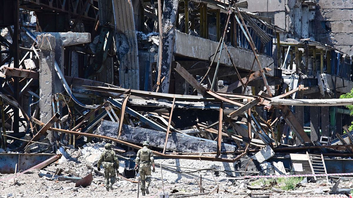 Russian servicemen patrol near the Azovstal steel plant in Mariupol, amid the ongoing Russian military action in Ukraine, on June 13, 2022. (Photo by Yuri KADOBNOV / AFP)