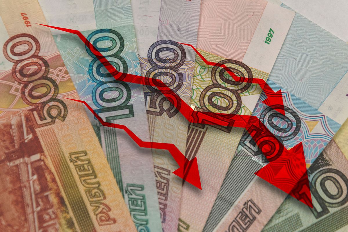 red arrows pointing down on the background of russian money