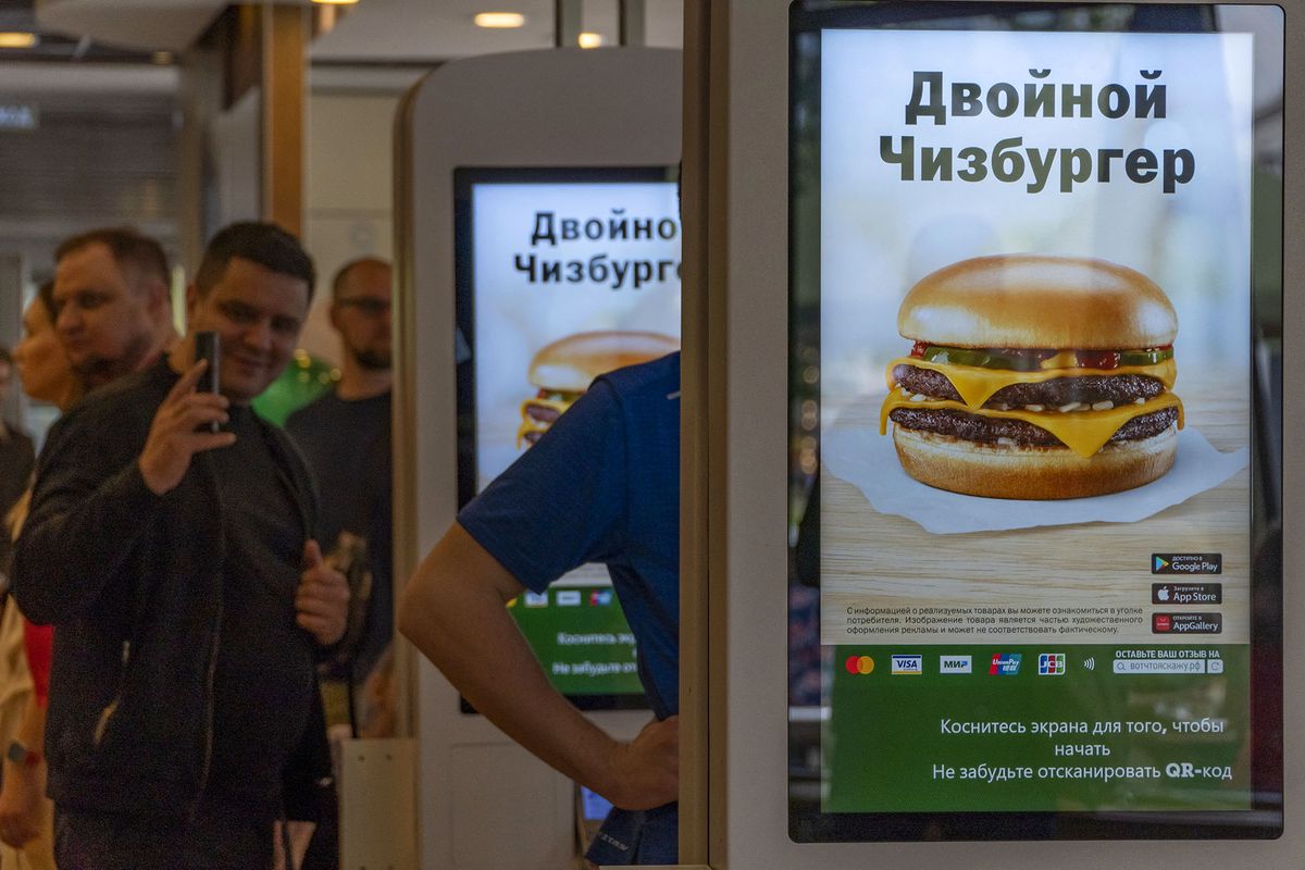 MOSCOW, RUSSIA - JUNE 12: People visit former US fast food-chain McDonald's restaurant during its reopening under a new name Vkusno i Tochka, which translates as "Tasty, period in Moscow, Russia on June 12, 2022. The burger giant had suspended operations of all its 850 restaurants in Russia over the war in Ukraine in March, and announced a full exit in May. The chain was sold to businessman Oleg Govor, a local licensee since 2015, who now plans to reopen all its restaurants by the end of summer and expand the new brand to 1,000 locations across the country within two years. Evgenii Bugubaev / Anadolu Agency (Photo by Evgenii Bugubaev / ANADOLU AGENCY / Anadolu Agency via AFP)