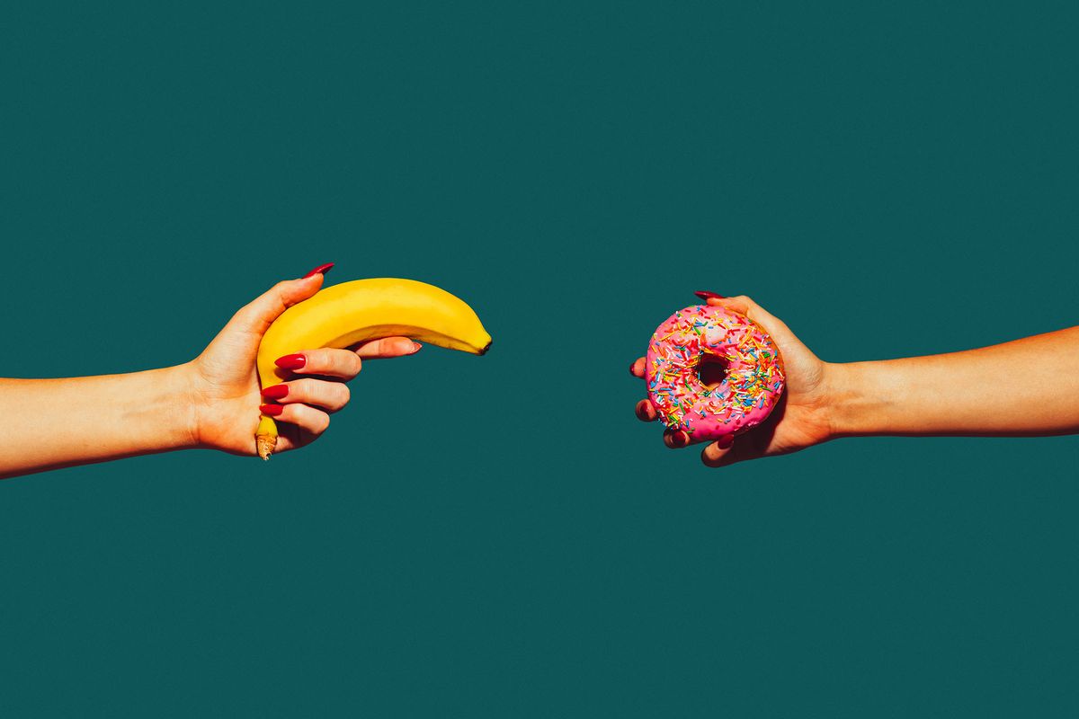 Banana and donut. Modern art collage in pop-art style. Hands isolated on trendy colored background with copyspace, contrast. Modern design with copyspace for advertising. Trendy colors.