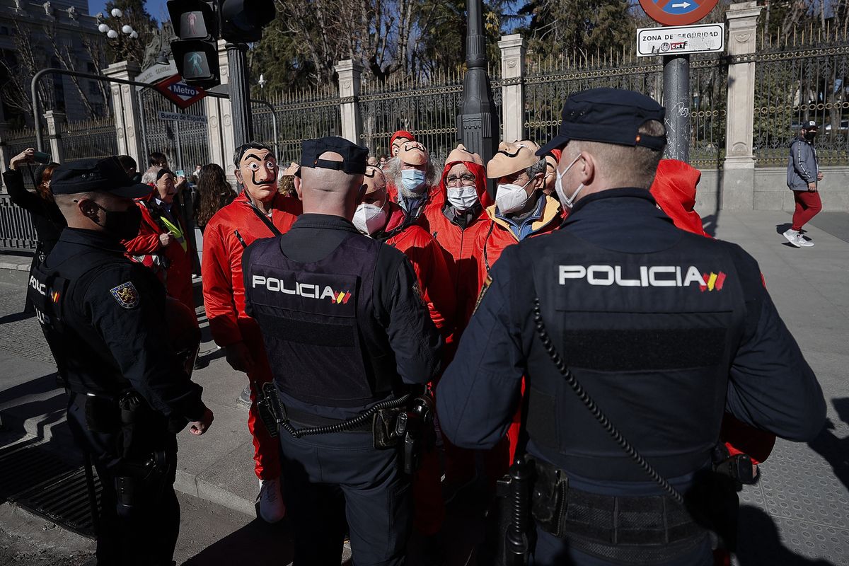 Pensioners, wearing series La Casa de Papel costumes, gather for protest in Spain