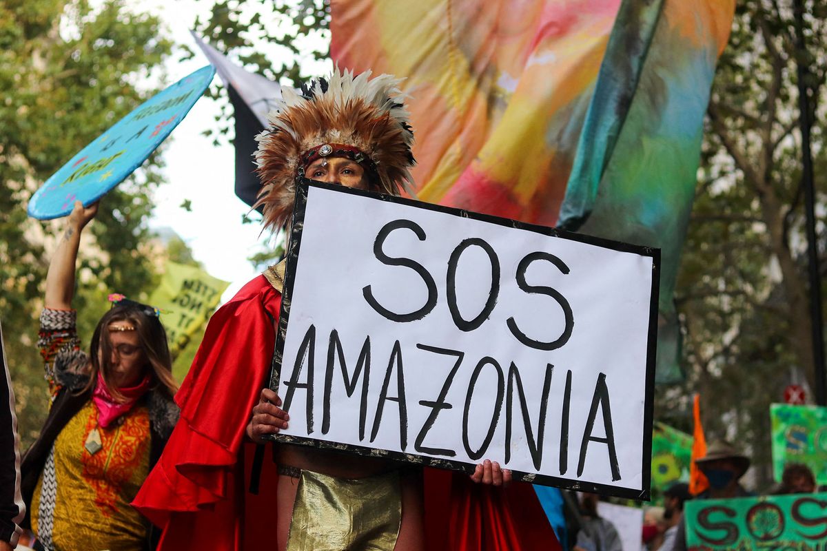 Activists of international climate action group Extinction Rebellion, stage a march from Parliament Square to the Brazilian Embassy, in London, UK, on September 5, 2020 to bring awarness to destruction of the Amazon Rainforest. (Photo by Lucy North/MI News/NurPhoto) (Photo by MI News / NurPhoto / NurPhoto via AFP)