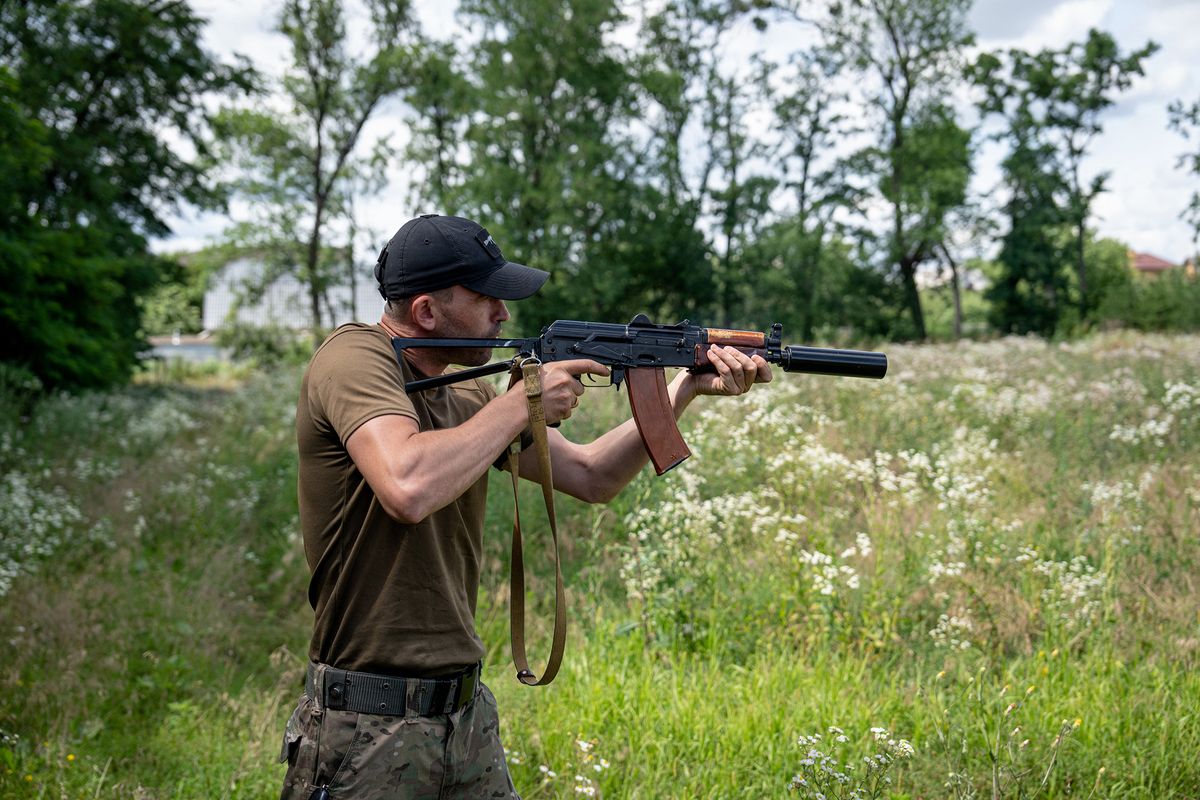 Russia-Ukraine war, KHARKIV, UKRAINE - JULY 20: A Ukrainian is seen testing a volunteer-made suppressor on the rifle in Kharkiv, Kharkiv Oblast, Ukraine on 20 July, 2022. A 46-year-old man Oleg manufactures suppressors to be donated to the military at his machine shop. The Russia-Ukraine war continues with the attacks on the city of Kharkiv, which is on the front line in eastern Ukraine. Wolfgang Schwan / Anadolu Agency (Photo by Wolfgang Schwan / ANADOLU AGENCY / Anadolu Agency via AFP)