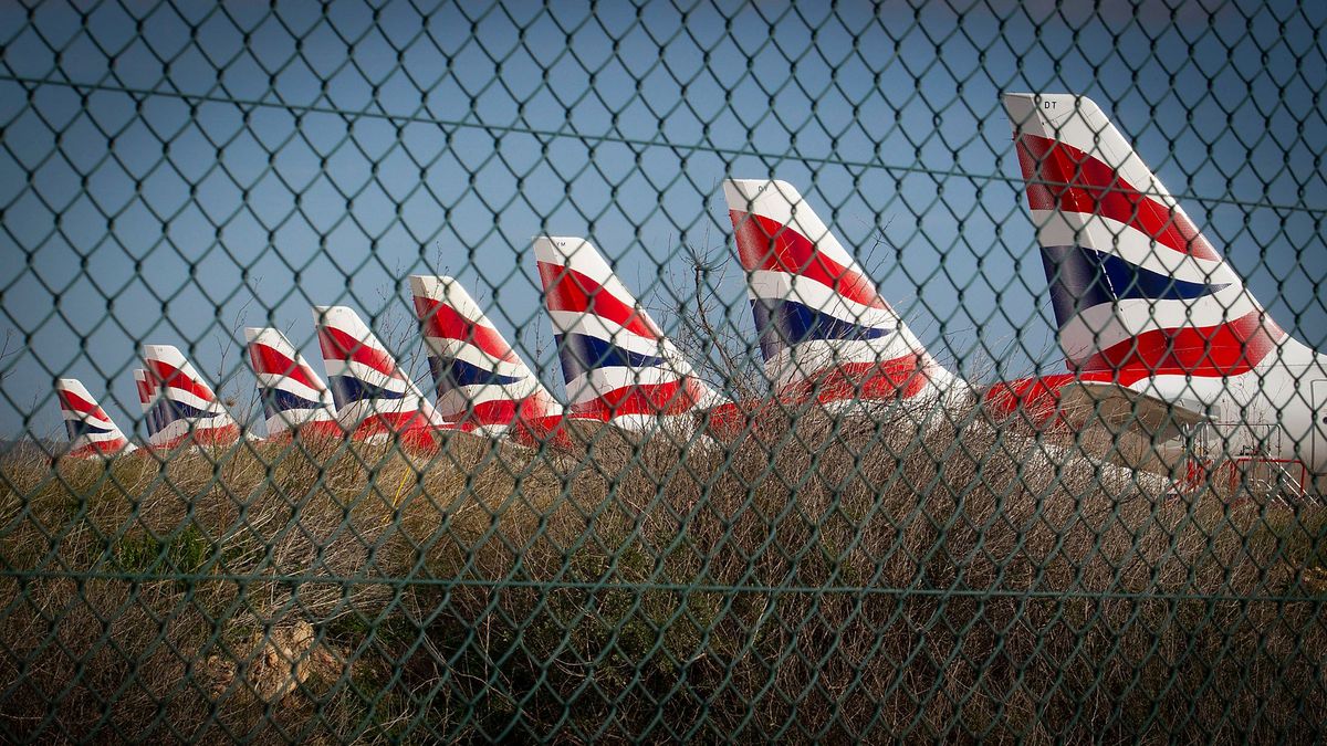 British Airways passenger planes are parked at Palma de Mallorca airport on January 21, 2021. - Due to the pandemic travel restrictions, airlines have been forced to ground thousands of planes across Europe. (Photo by JAIME REINA / AFP)