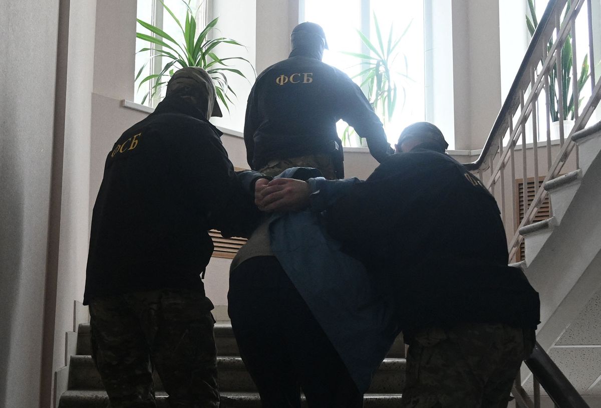 8194556 19.05.2022 Denis Muryga, deputy commander of the Aidar battalion of Ukrainian forces, detained on suspicion of participating in an illegal armed group, is escorted before a hearing at Leninsky District court in Rostov-on-Don, Russia. Sergey Pivovarov / Sputnik (Photo by Sergey Pivovarov / Sputnik / Sputnik via AFP)
