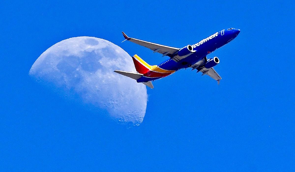 Boeing  737 plane files in front of the moon on July 07, 2022 in WHITTIER  , CA.  (Photo by Nick Ut/Getty Images)