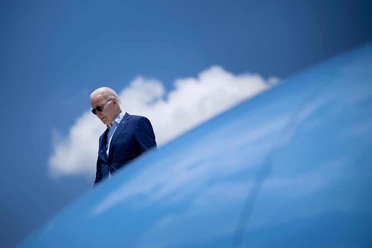 US President Joe Biden disembarks Air Force One at T.F. Green International Airport in Warwick, Rhode Island, on July 20, 2022. - Biden is travelling to Somerset, Massachusetts, to deliver remarks on the climate crisis and seizing the opportunity of a clean energy future. (Photo by Brendan Smialowski / AFP)