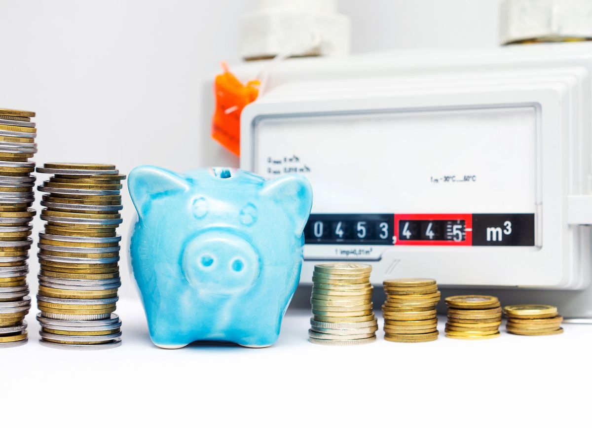Piggy,Bank,With,Coins,Near,The,Natural,Gas,Meter,At