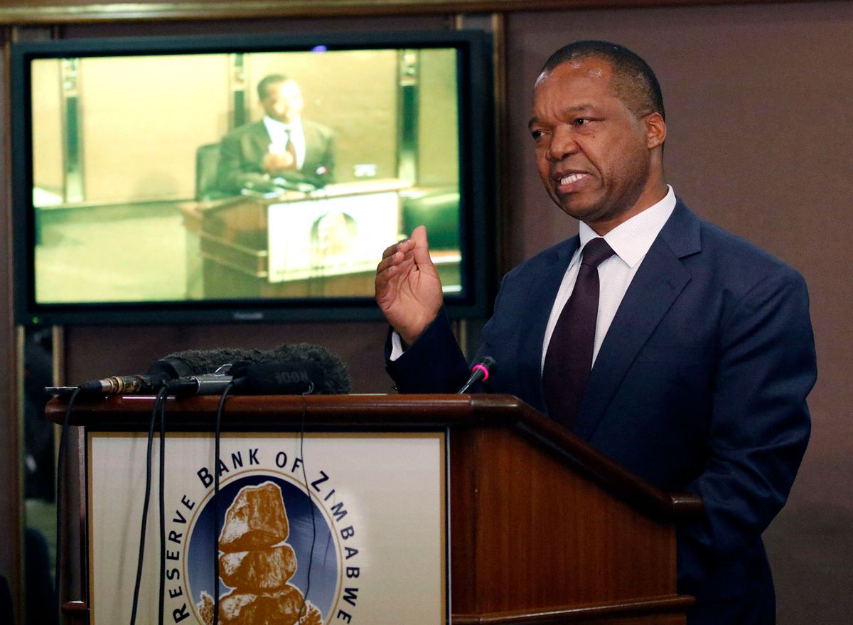 John Mangudya, Governor of Reserve Bank of Zimbabwe, the central bank, speaks during a press conference in Harare, Zimbabwe, on May 4, 2016. Zimbabwe's central bank on Wednesday announced a package of drastic measures to retain the U.S. dollar, the country's main circulation currency, in the economy as the liquidity crunch bites. (Photo by Xu Lingui / NurPhoto / NurPhoto via AFP)