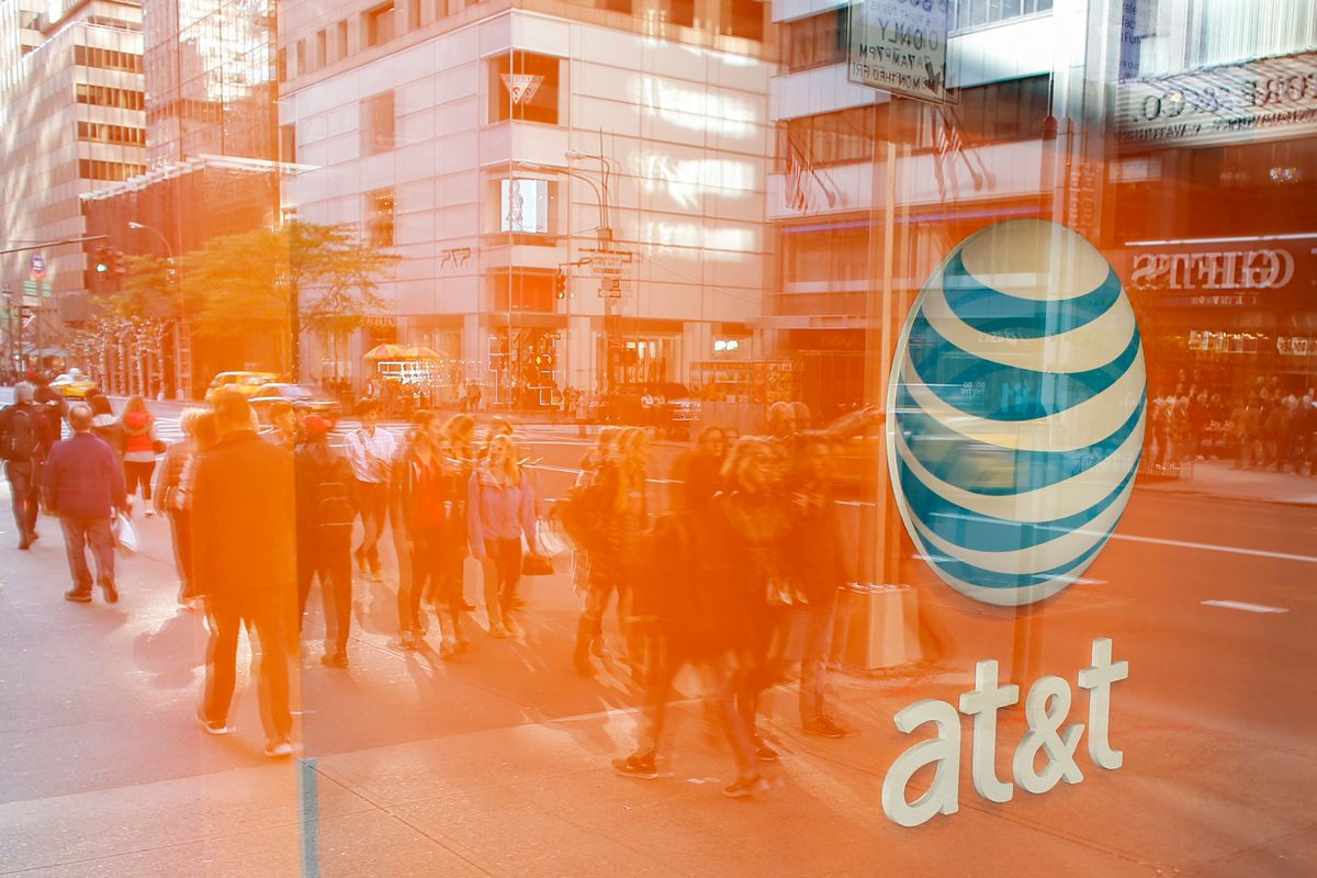 An AT&T store is seen on 5th Avenue in New York on October 23, 2016. - AT&T unveiled a mega-deal for Time Warner that would transform the telecom giant into a media-entertainment powerhouse positioned for a sector facing major technology changes. The stock-and-cash deal is valued at $108.7 billion including debt, and gives a value of $84.5 billion to Time Warner -- a major name in the sector that includes the Warner Bros. studios in Hollywood and an array of TV assets such as HBO and CNN. (Photo by KENA BETANCUR / AFP)