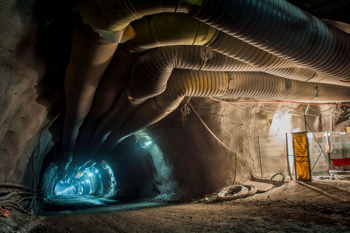 Handout picture released by the National Copper Corporation of Chile (CODELCO) showing  the construction of the underground operations of the Chuquicamata mine in Calama, on November 27, 2017. - Chilean mining company Codelco, the largest copper producer in the world, inaugurated this Wednesday the underground operations of the emblematic Chuquicamata mine, located in the Atacama desert (northern Chile). This was for decades the largest open pit copper deposit in the world, but in order to extend its useful life, Codelco decided to invest 5,000 million dollars in this monumental work. (Photo by Olivier Llaneza / CODELCO / AFP) / RESTRICTED TO EDITORIAL USE - MANDATORY CREDIT "AFP PHOTO / CODELCO / Olivier LLANEZA" - NO MARKETING NO ADVERTISING CAMPAIGNS - DISTRIBUTED AS A SERVICE TO CLIENTS