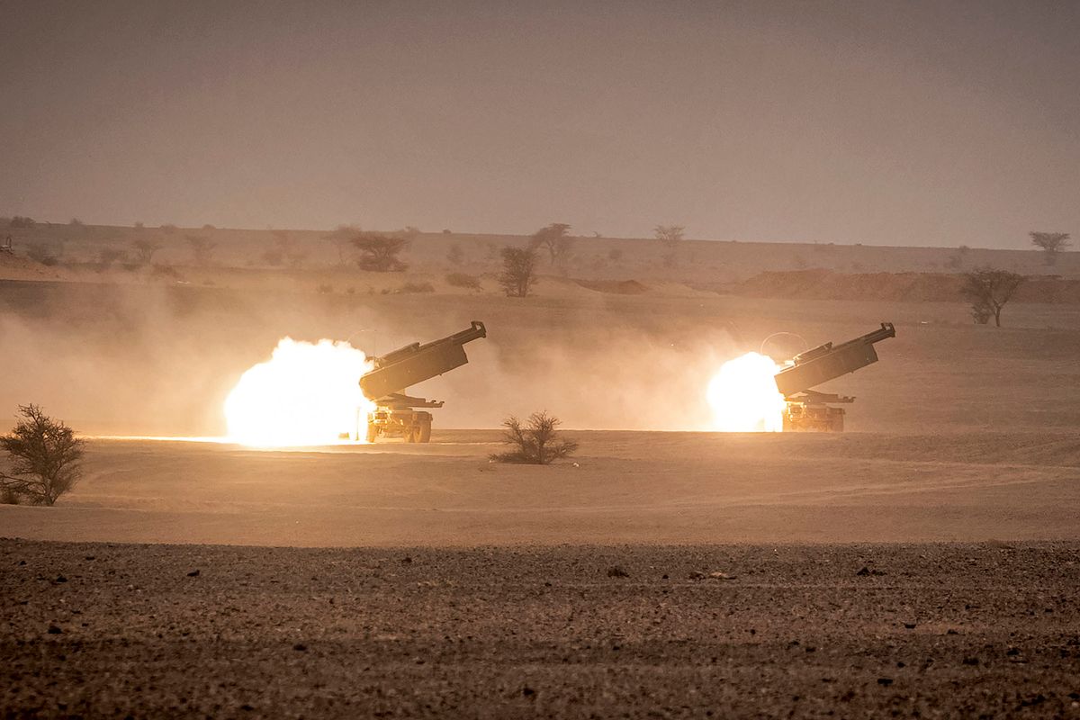 US M142 High Mobility Artillery Rocket System (HIMARS) launchers fire salvoes during the "African Lion" military exercise in the Grier Labouihi region in southeastern Morocco on June 9, 2021. (Photo by FADEL SENNA / AFP)