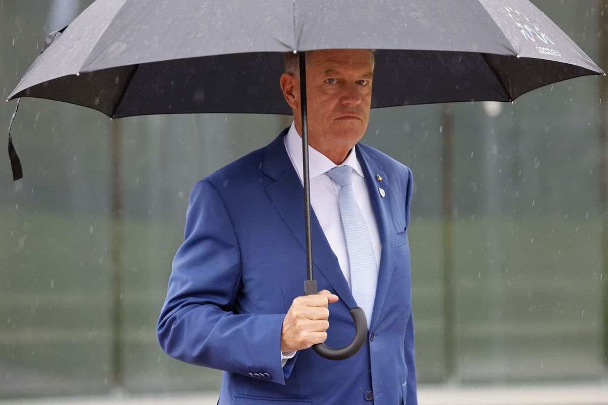 Romania's President Klaus Werner Iohannis leaves the EU-Western Balkans summit at Brdo Congress Centre, near Ljubljana on October 6, 2021. - Western Balkan countries can expect reassurances but no concrete progress on their stalled bids for European Union membership when EU leaders meet today. (Photo by Ludovic MARIN / AFP)