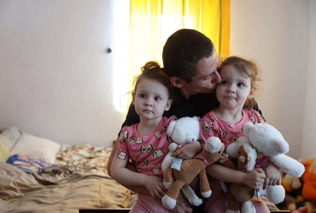 Ukraine Crisis / father and twins evacuate to western village