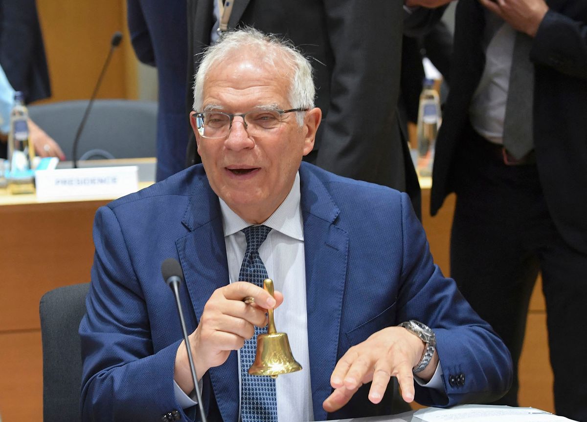 European Union for Foreign Affairs and Security Policy Joseph Borrell rings the bell during a Foreign Affairs Council meeting at the EU headquarters in Brussels on May 16, 2022. (Photo by JOHN THYS / AFP)