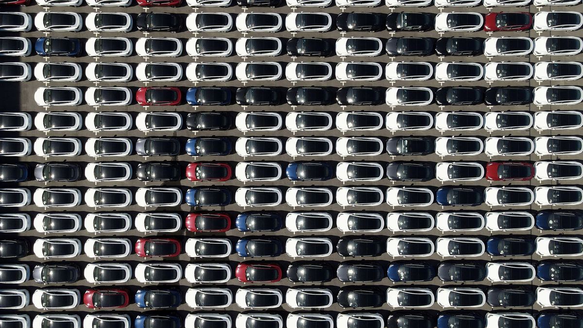 An aerial view shows imported cars, including Tesla electric vehicles, parked at Taipei Port in New Taipei City on November 11, 2021. (Photo by Sam Yeh / AFP)