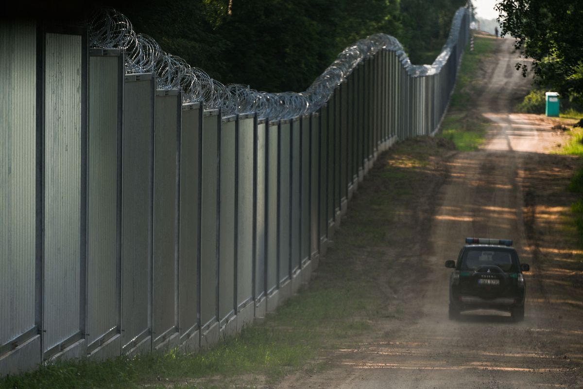 General view of the new wall on the Polish-Belarusian border.Prime Minister Mateusz Morawiecki appeared on the Polish-Belarusian border at the border wall, which the Polish government called a 'physical barrier'. He participated in the handover of this steel and concrete structure to the Border Guard, by the contractor of the project, Budimex, Unibep and Budrex companies.The border wall on the Polish-Belarusian border was built with the use of 50,000 tons of steel. It is 5.5 meters high,  topped with a razor wire and it stretches for 186.25 km. On Thursday, June 30, 2022, in Nowodziel, near Kuznica, Podlaskie Voivodeship, Poland. (Photo by Artur Widak/NurPhoto) (Photo by Artur Widak / NurPhoto / NurPhoto via AFP)