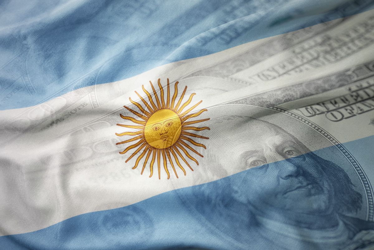 Colorful,Waving,National,Flag,Of,Argentina,On,A,American,Dollar