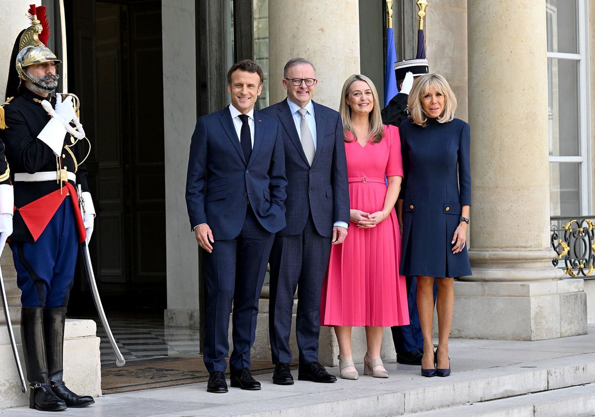(From L) France's President Emmanuel Macron, Australia's Prime Minister Anthony Albanese, his spouse Jodie Haydon and Emmanuel Macron's wife Brigitte Macron pose prior to a working lunch at the presidential Elysee Palace in Paris on July 1, 2022. (Photo by Emmanuel DUNAND / AFP)