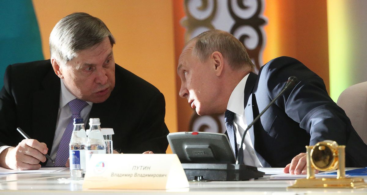 Russian President Vladimir Putin Visits Kazakhstan, PETROPAVLOVSK, KAZAKHSTAN - NOVEMBER 9: (RUSSIA OUT) Russian President Vladimir Putin (R) talks to his aide Yuri Ushakov (L) during the 15th Forum of Interregional Cooperation of Russia and Kazakhstan on November 9, 2018 in Petropavlovsk, Kazakhstan. Vladimir Putin is on a two-day state visit to Kazakhstan. (Photo by Mikhail Svetlov/Getty Images)