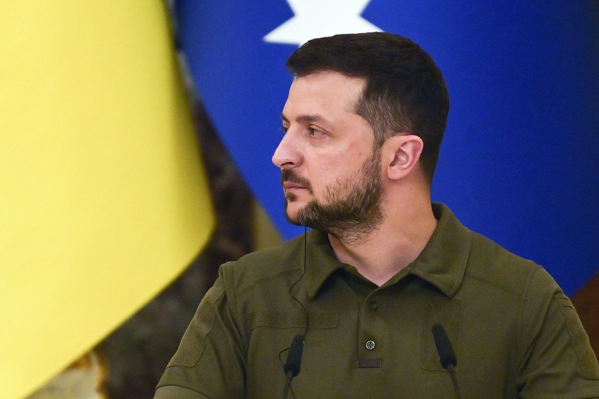 Ukrainian President Volodymyr Zelensky listens during a joint press conference with Australia's Prime Minister at Mariynsky Palace following a meeting in Kyiv on July 3, 2022 amid the Russian invasion of Ukraine. (Photo by Miguel MEDINA / AFP)