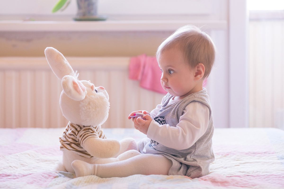 10,Months,Old,Baby,Girl,Interacting,With,A,Plush,Toy