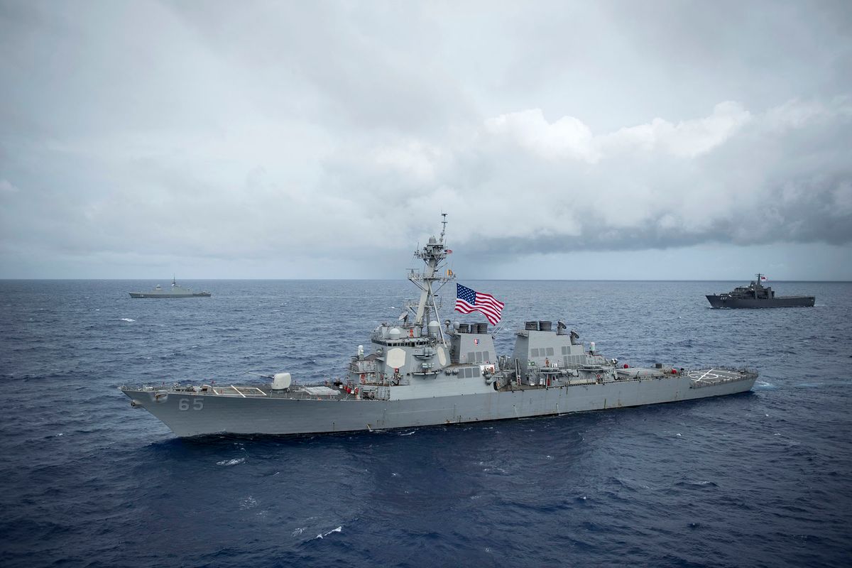 This image released by the US Navy on August 28 12, 2017, shows the Arleigh Burke-class guided-missile destroyer USS Benfold (DDG 65), front, Republic of Singapore Navyís (RSN) RSS Supreme (FFS 73), L, and RSS Endurance (LST 207), R, participating in a PHOTOEX during Exercise Pacific Griffin 2017, off the coast of Guam, August 28, 2017. - The US Navy destroyer USS Benfold was involved in a minor collision with a Japanese tugboat on November 18, 2017 during a scheduled exercise, according to the US Navy's 7th Fleet. (Photo by Benjamin A. Lewis / US NAVY / AFP) / RESTRICTED TO EDITORIAL USE - MANDATORY CREDIT "AFP PHOTO / US NAVY /Mass Communications Specialist 1st Class Benjamin A. Lewis" - NO MARKETING NO ADVERTISING CAMPAIGNS - DISTRIBUTED AS A SERVICE TO CLIENTS