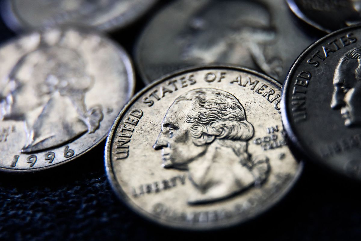 United States quarter dollar coins are seen in this illustration photo taken in Krakow, Poland on June 13, 2022. (Photo illustration by Jakub Porzycki/NurPhoto) (Photo by Jakub Porzycki / NurPhoto / NurPhoto via AFP)