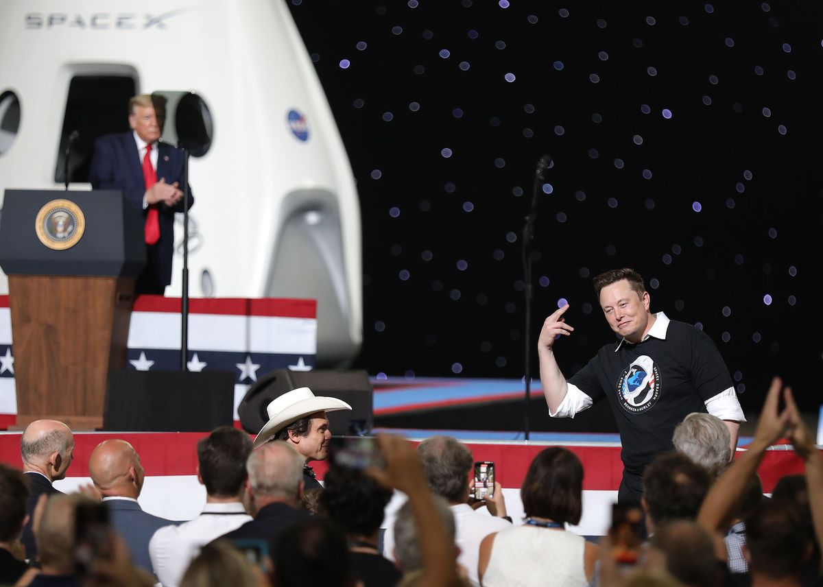1236145171 CAPE CANAVERAL, FLORIDA - MAY 30: U.S. President Donald Trump acknowledges Spacex founder Elon Musk (R) after the successful launch of the SpaceX Falcon 9 rocket with the manned Crew Dragon spacecraft at the Kennedy Space Center on May 30, 2020 in Cape Canaveral, Florida. Earlier in the day NASA astronauts Bob Behnken and Doug Hurley lifted off an inaugural flight and will be the first people since the end of the Space Shuttle program in 2011 to be launched into space from the United States. (Photo by Joe Raedle/Getty Images)