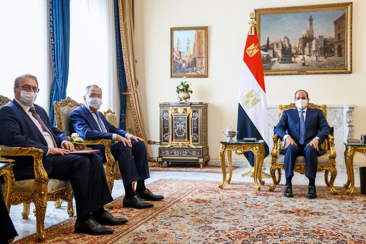 A handout picture released by the Russian Foreign Ministry Press Service shows Russian Foreign Minister Sergei Lavrov (2nd L) attending a meeting with Egyptian President Abdel Fattah al-Sisi (R) at the presidential palace in the capital Cairo on July 24, 2022.