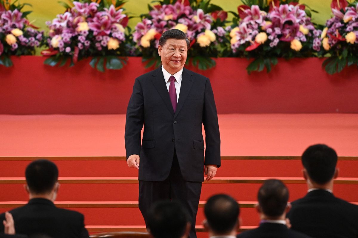 China's President Xi Jinping leaves the podium following his speech after a ceremony to inaugurate the city's new leader and government in Hong Kong on July 1, 2022, on the 25th anniversary of the city's handover from Britain to China. (Photo by Selim CHTAYTI / POOL / AFP)