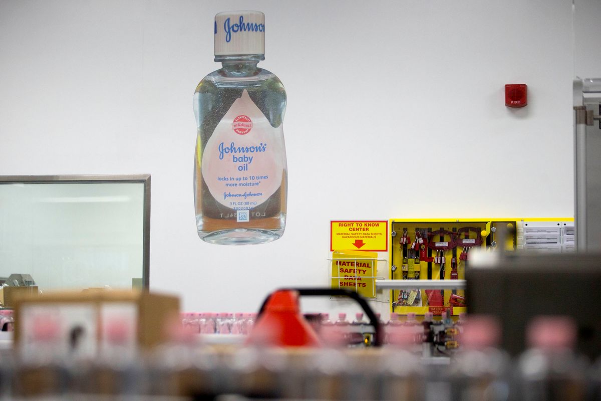 451615700 A Johnson & Johnson (J&J) Johnson's brand baby oil image hangs on a wall at the J&J consumer healthcare products plant in Lititz, Pennsylvania, U.S., on Wednesday, June 18, 2014. Johnson & Johnson, the world's biggest health-care products company, beat expectations in its first-quarter earnings release in April and raised its 2014 forecast by focusing on new drugs and reducing its reliance on medical devices. J&J is expected to release second-quarter earnings figures on July 15. Photographer: Andrew Harrer/Bloomberg via Getty Images