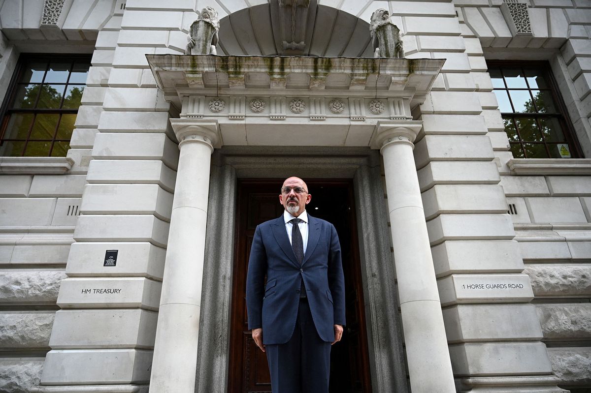 Britain's newly appointed Chancellor of the Exchequer Nadhim Zahawi poses for a photograph as he arrives at the HM Treasury to start his new job, in central London on July 6, 2022. - UK Prime Minister Boris Johnson suffered two shock departures from his government Tuesday, including his finance minister, as civil war erupted in the high command of the ruling Conservative party. (Photo by Daniel LEAL / AFP)