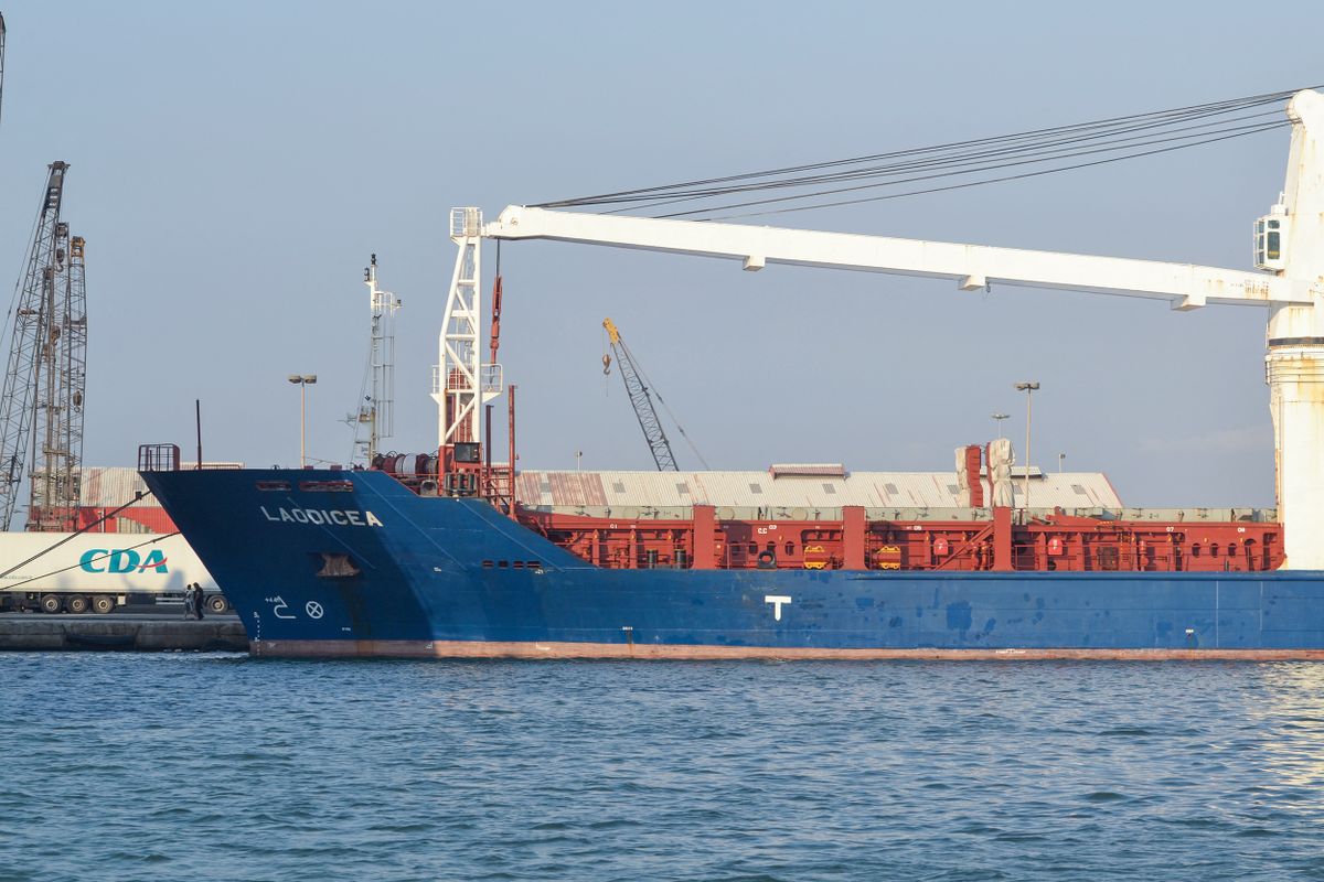 A picture shows a view of the bow of the grain-laden Syrian-flagged ship Laodicea, docked in Lebanon's northern port of Tripoli, on July 30, 2022. - A Lebanese prosecutor ordered "the seizure of the ship until the investigation is completed", instructing the police to consult the Ukraine embassy after it claimed that the grain cargo was loaded from a region occupied by Russian forces. (Photo by Fathi AL-MASRI / AFP)